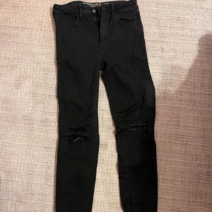 American Eagle Black Skinny Jeans with holes at knees (size 6)